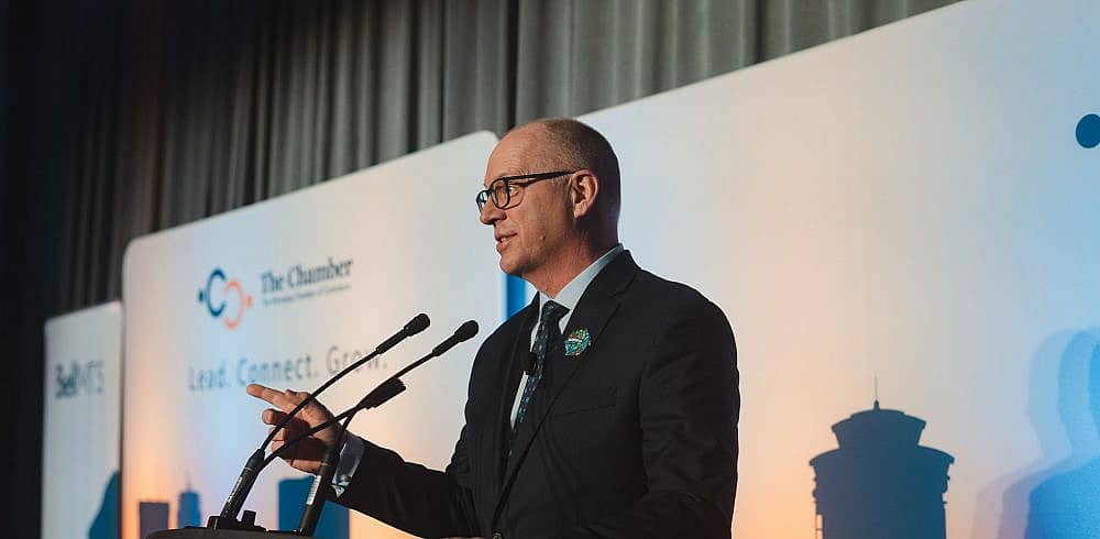 Mayor Scott Gillingham speaks on stage at Winnipeg Chamber of Commerce's State of The City